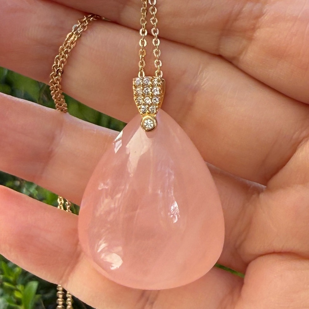 Natural rose quartz puffy tear drop pendant and gold tone chain